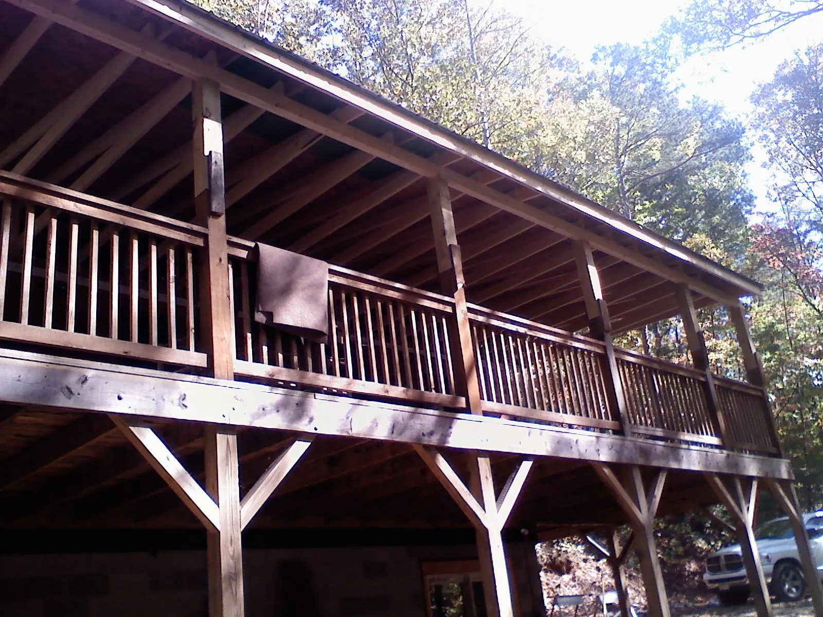 Timber framing under a new elevated porch and deck — Roof Leak Repair in Lake Grove by Roofing Brothers
